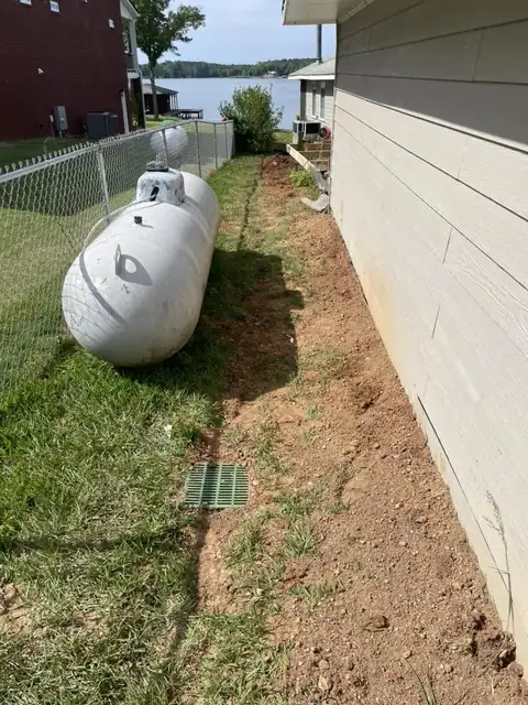 Graded side yard with a catch basin
