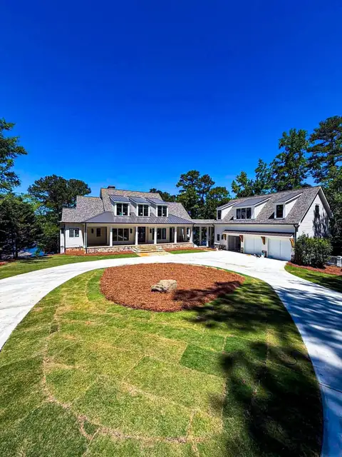 Freshly laid sod in front of two new homes