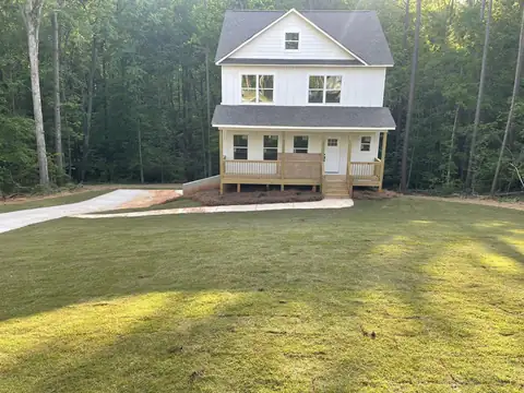 New two-story house with a fresh sod lawn