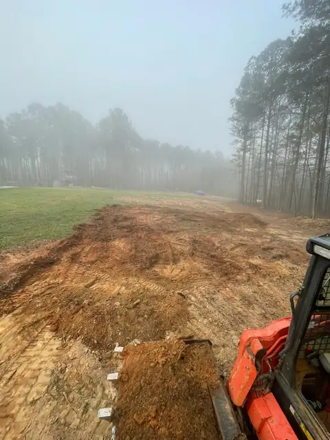 Early morning grading with the loader