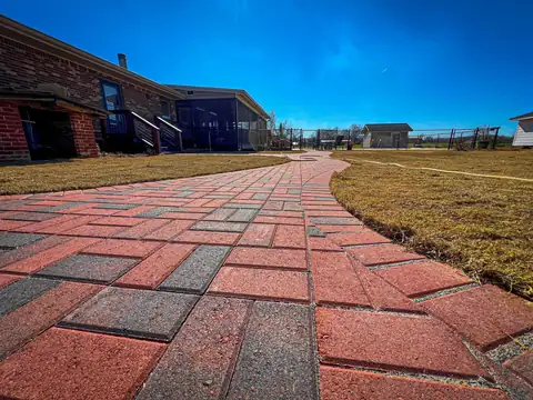 The walkway running along the back of the house