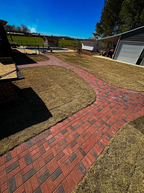 Curving walkway through the new lawn