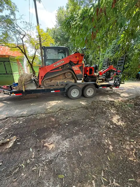 Compact track loader on site for the regrade