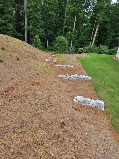 Rock lines stepping down the hillside